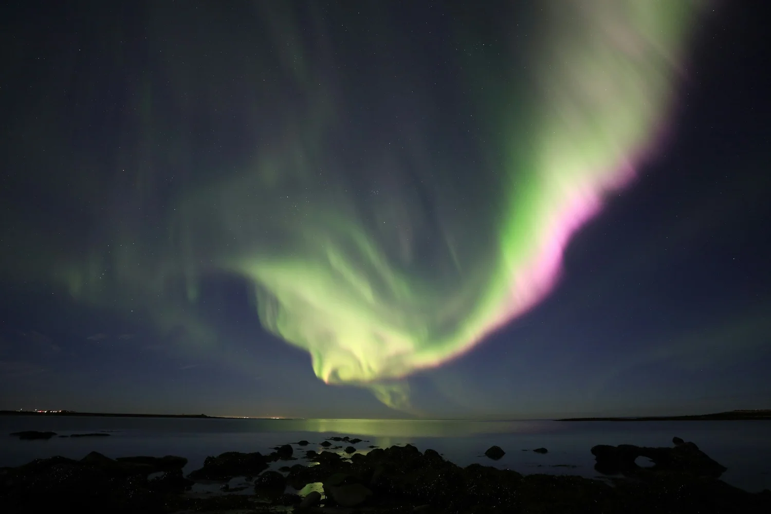 Northern lights over the sea Iceland
