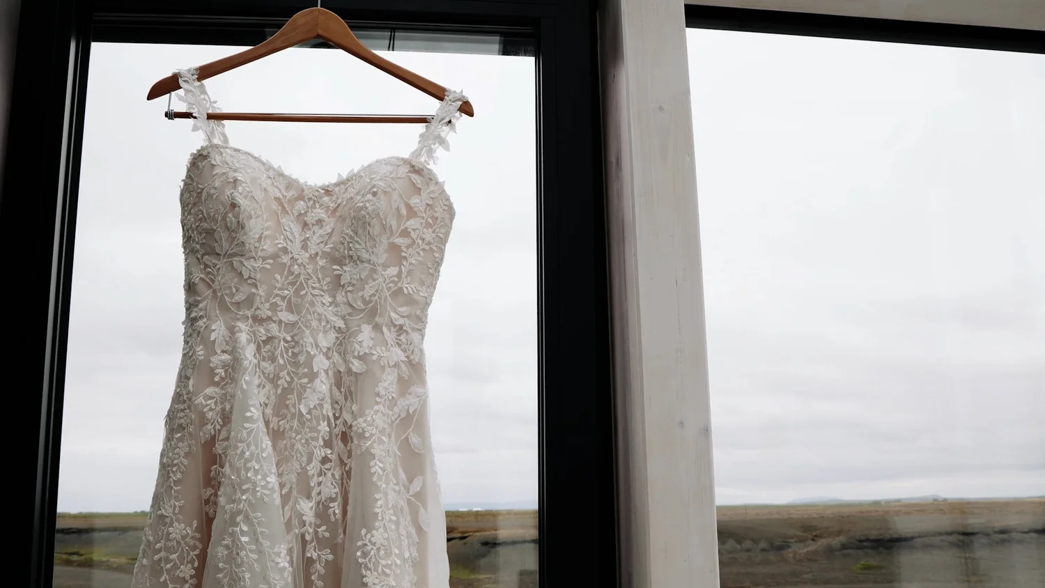 Wedding dress hangs at Iceland elopement glass cottages
