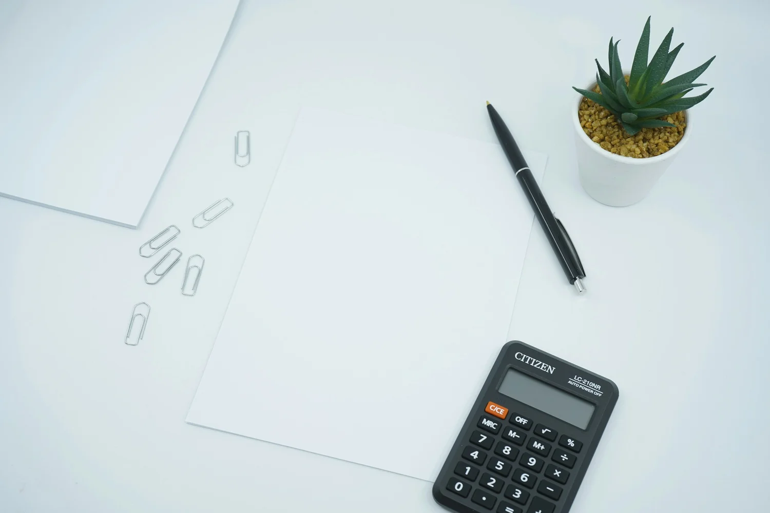 Calculator and paper ready to work out Iceland elopement budget