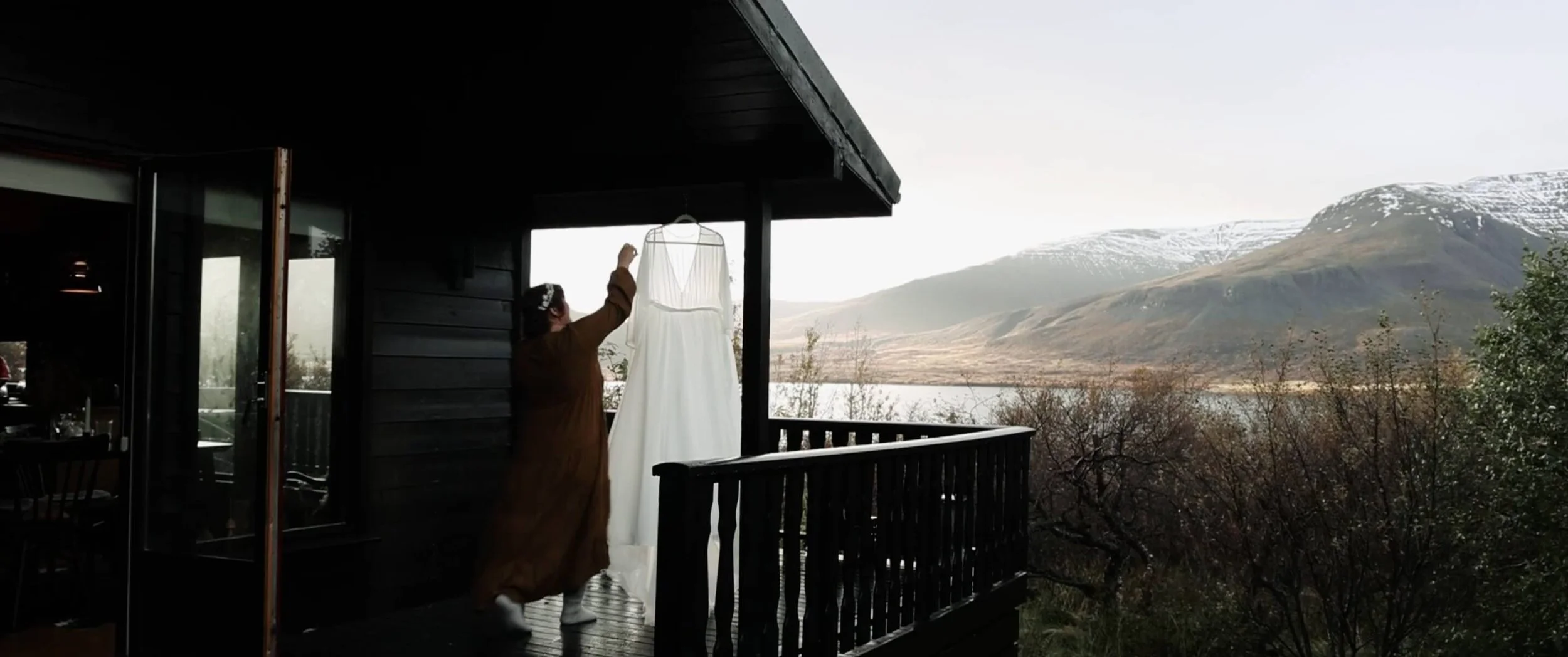 bride hangs up wedding dress for iceland elopement